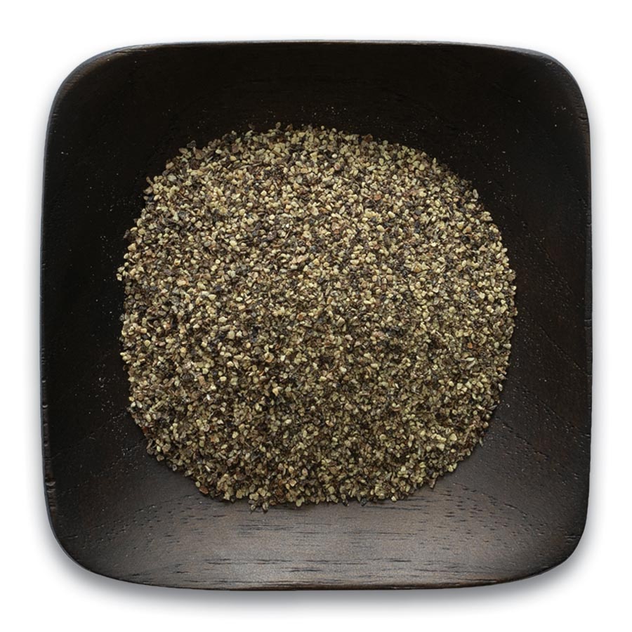 Pepper, Ground Black, Medium - Seeds for Generations Medium-ground black pepper in a dark dish.