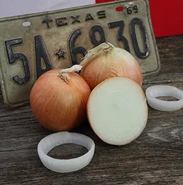 Texas 1015 Super Sweet Onions with one sliced into large rings.